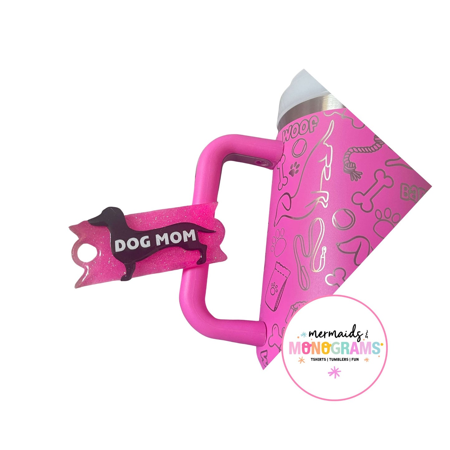 Pink dog tumbler with matching “Dog Mom” dachshund acrylic topper on lid