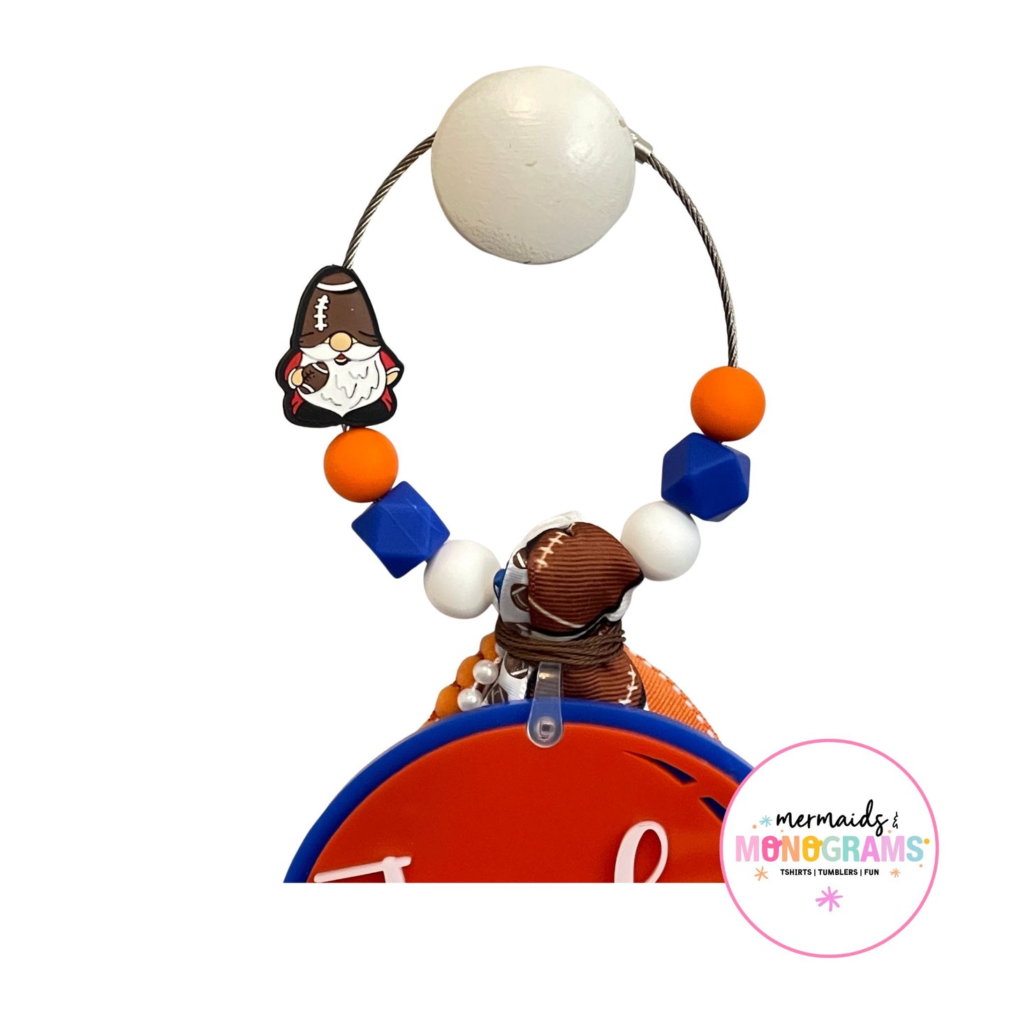 Top of the bag tag showing orange and blue beads and football gnome charm on cable loop