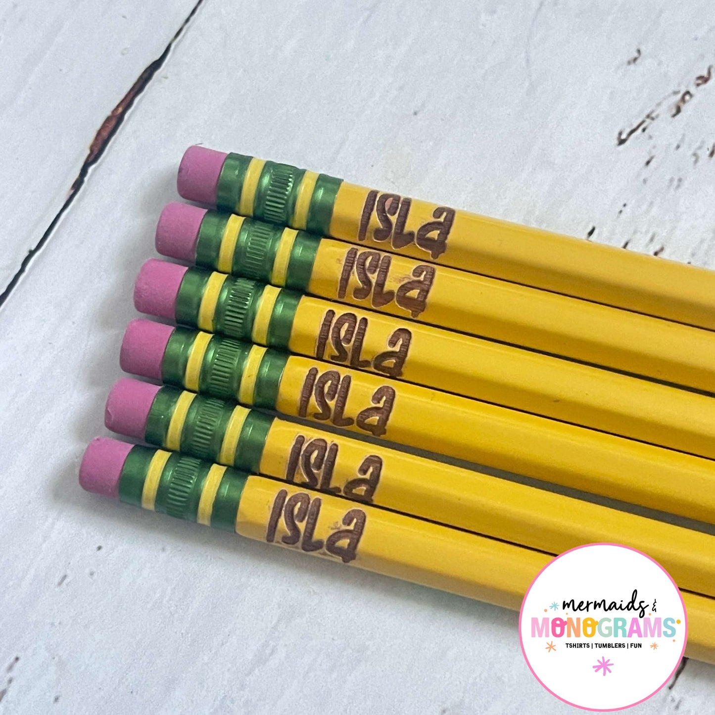 Close Up set of six yellow pencils with custom engraved name