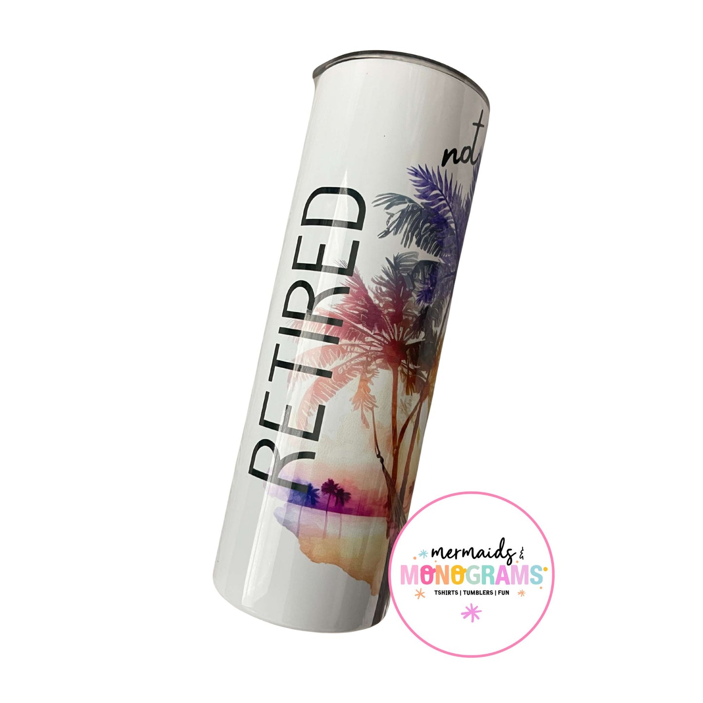 White sublimation tumbler with bold “RETIRED” lettering and palm sunset art