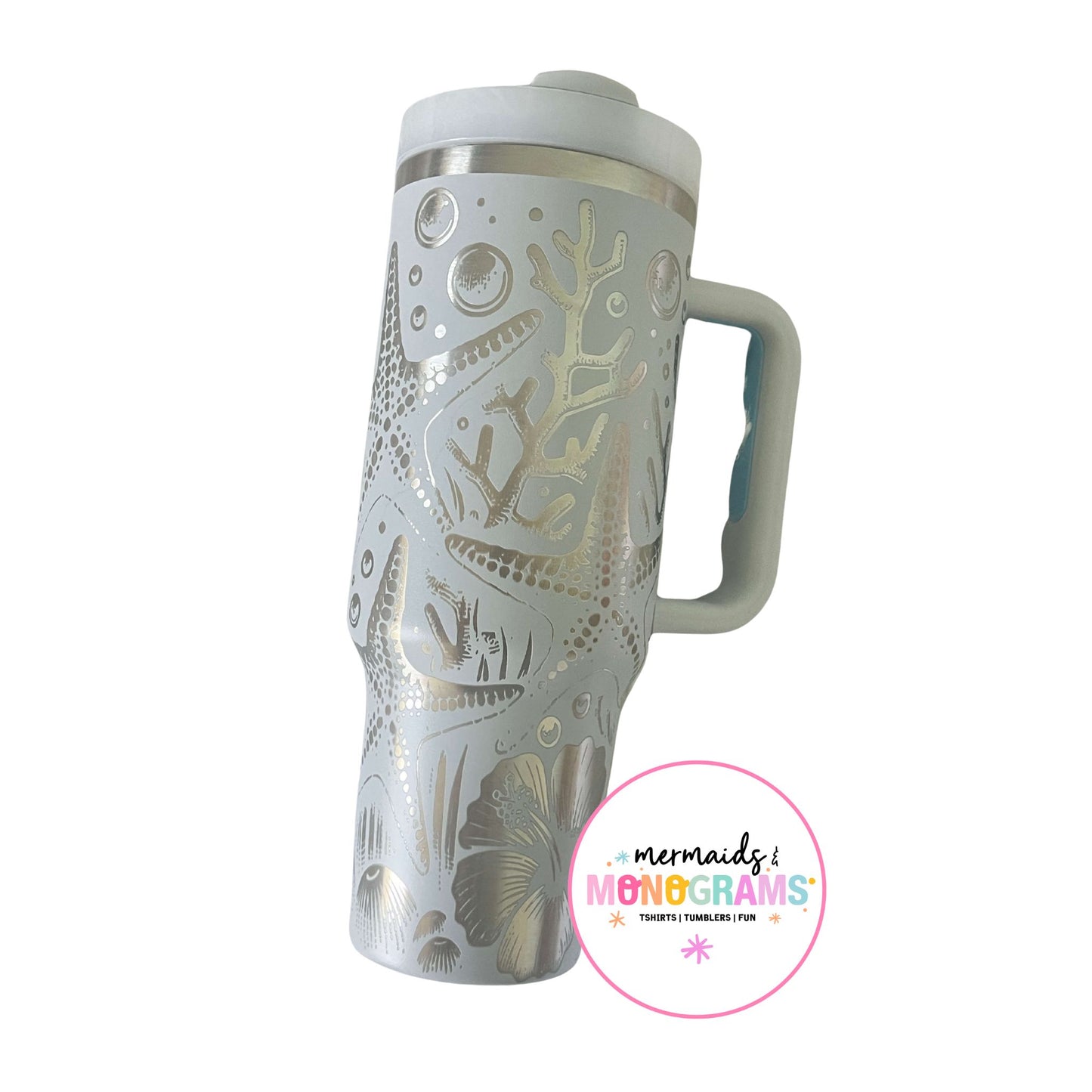Ocean-themed 40oz tumbler with coral, starfish, and tropical floral engravings