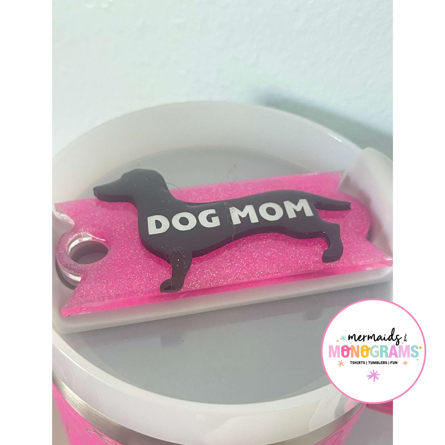 Pink acrylic dachshund topper on 40oz cup reading "DOG MOM"