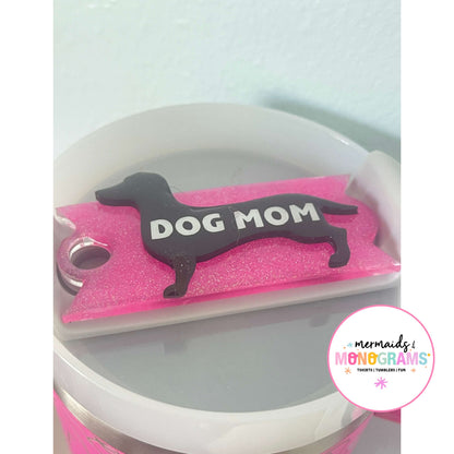 Pink acrylic dachshund topper on 40oz cup reading "DOG MOM"