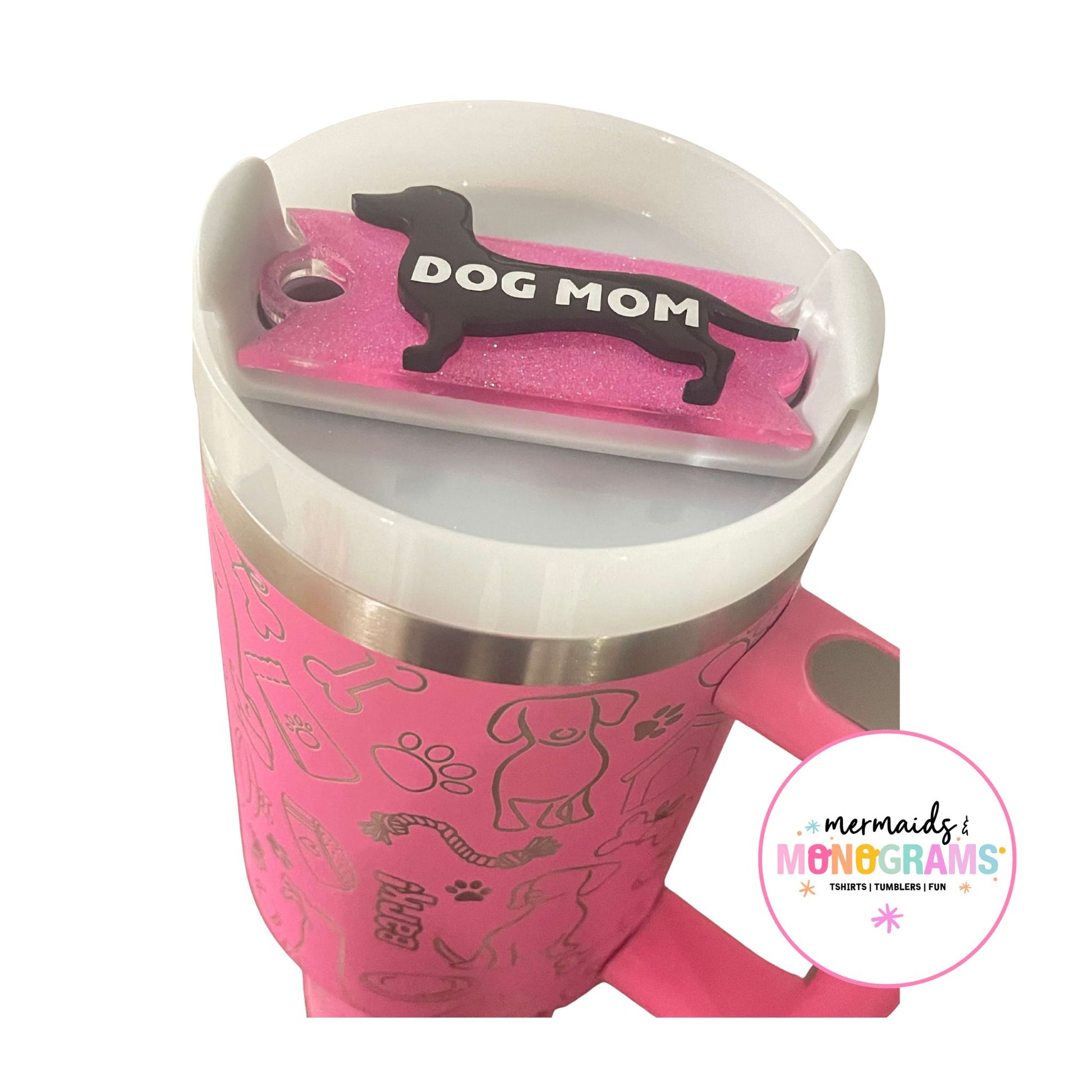 Full view of acrylic topper on pink dog-themed tumbler with handle