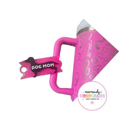 Pink dog tumbler with matching “Dog Mom” dachshund acrylic topper on lid