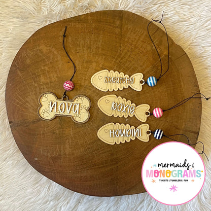 Personalized pet tags on a wooden board 
