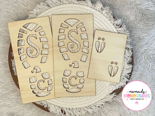 Wooden stencils with letter 'S' and 'C' designs on a textured surface.