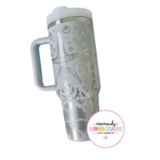 Side view of 40oz tumbler with beachy etching and ergonomic handle
