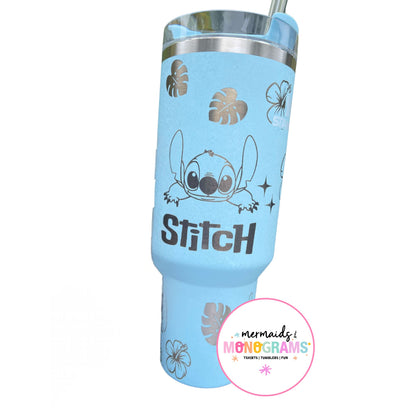 Back of tumbler with “Stitch” name engraving and leaf motifs