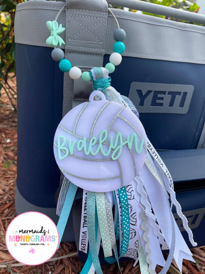 Volleyball themed keychain with 'Braelyn' on a YETI cooler