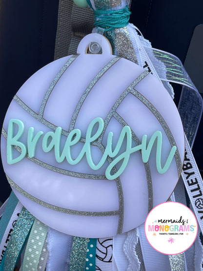 Decorative item with 'Braelynn' on a white background, featuring ribbons 