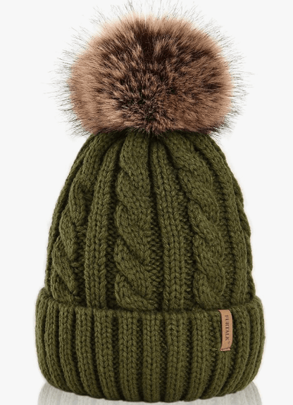 Green knit beanie with a brown fur pom-pom on a white background