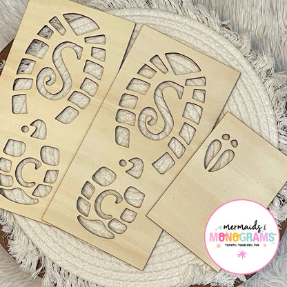 "Wooden Santa boot and reindeer footprint stencils displayed on white textured fabric – perfect for creating magical Christmas morning trails."