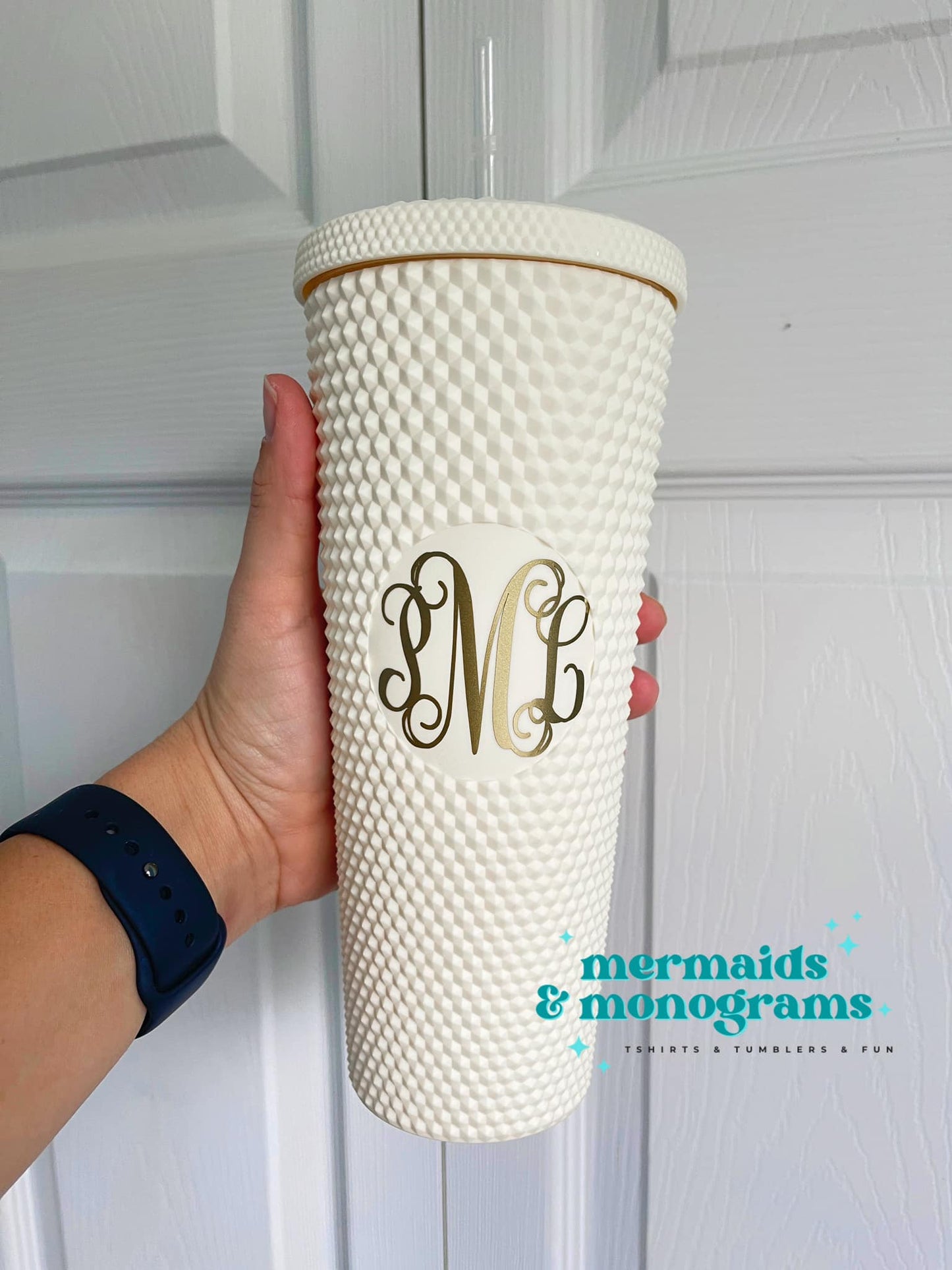 White studded tumbler with gold monogram decal